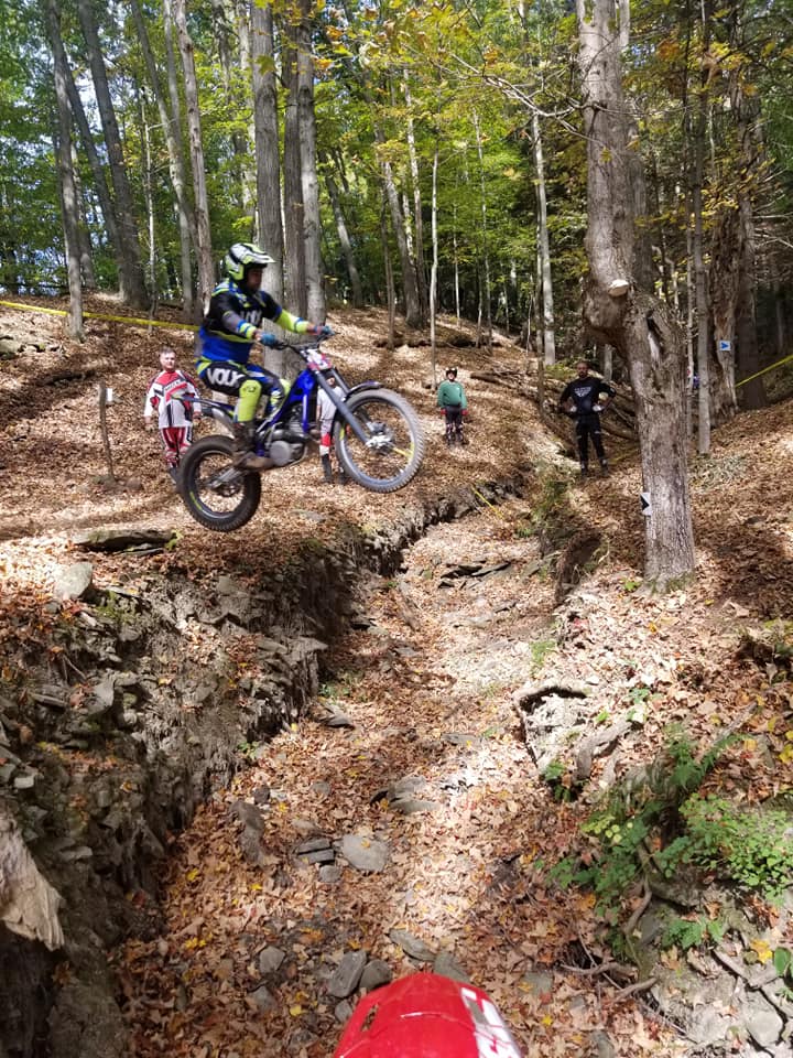 Jumping in a trials section on a Sherco motorcycle